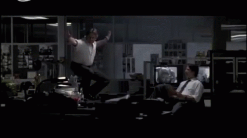 A Man Is Jumping In The Air While Another Man Looks On GIF