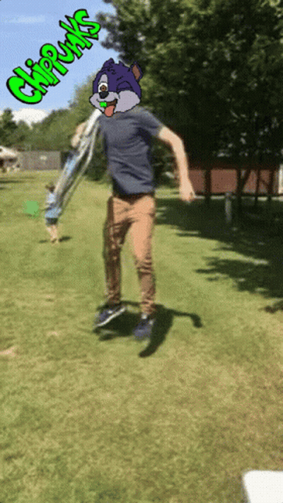 A Man Is Jumping In The Air With A Chipmunks Cartoon On His Face GIF