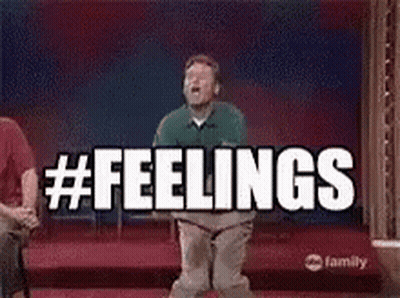 A Man Is Jumping In The Air With The Words `` Feelings '' Written On The Screen Behind Him . GIF