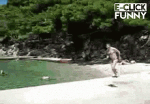 A Man Is Jumping Into A Body Of Water With The Words E-Click Funny On The Bottom GIF