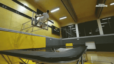 A Man Is Jumping Over A Trampoline In A Gym With The Words Awesome On The Bottom Right GIF
