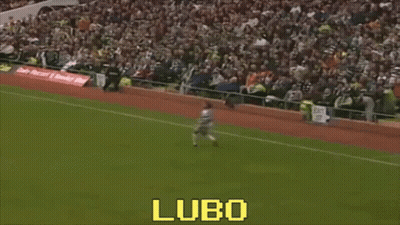 A Man Is Kicking A Soccer Ball On A Field With The Word Lubo On The Bottom Right GIF