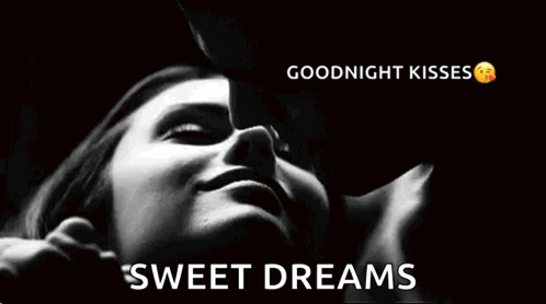 A Man Is Kissing A Woman On The Cheek In A Black And White Photo With The Words `` Goodnight Kisses Sweet Dreams '' . GIF