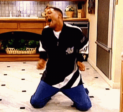 A Man Is Kneeling Down In A Kitchen Wearing A Black And White Jersey With The Number 47 On It GIF