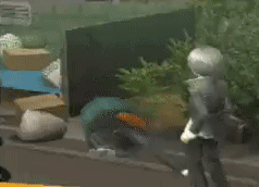 A Man Is Kneeling Down In Front Of A Bunch Of Boxes GIF