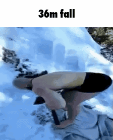 A Man Is Kneeling Down In The Snow With A Shovel And The Words 36M Fall Above Him . GIF