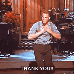 A Man Is Kneeling Down On A Stage With His Hands Folded And Says `` Thank You '' . GIF