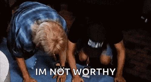 A Man Is Kneeling Down With The Words " Im Not Worthy " Written Below Him GIF