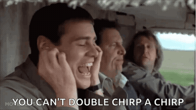 A Man Is Laughing While Sitting In A Car With Two Other Men And Covering His Ears . GIF