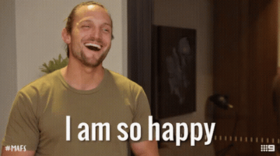 A Man Is Laughing With The Words I Am So Happy Above Him GIF