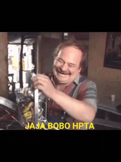 A Man Is Laughing With The Words Jaja Bobo Hpta Behind Him GIF