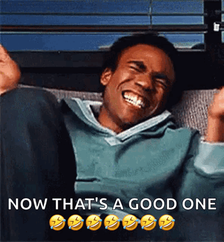 A Man Is Laughing With The Words Now That 'S A Good One Above Him GIF