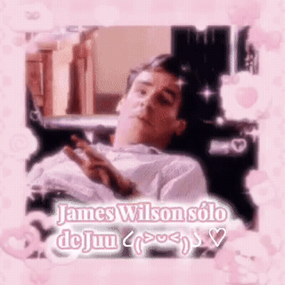 A Man Is Laying Down In A Chair With A Pink Frame Around Him And The Words `` James Wilson Solo Dejun '' . GIF