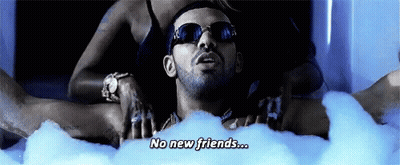 A Man Is Laying In A Bathtub With Bubbles And Says No New Friends .. GIF
