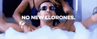 A Man Is Laying In A Bathtub With The Words No New Llorones GIF