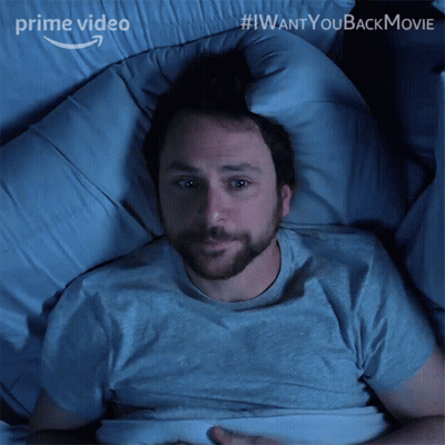 A Man Is Laying In A Bed With The Words " I Want You Back Movie " On The Bottom GIF