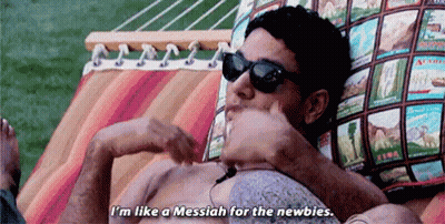 A Man Is Laying In A Hammock Wearing Sunglasses And A Shirtless Body . GIF