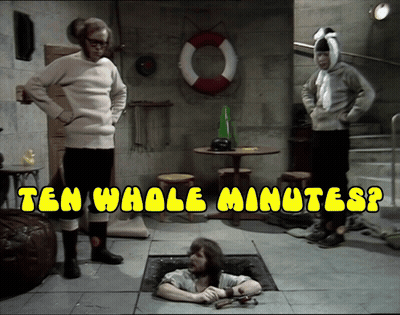 A Man Is Laying In A Hole With The Words Ten Whole Minutes Written Above Him GIF