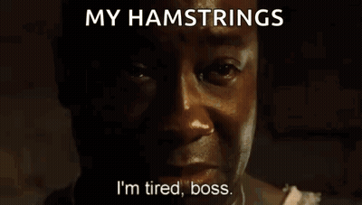 A Man Is Laying In Bed With A Plaid Blanket And The Words `` My Hamstrings '' Written Above Him . GIF