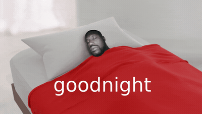 A Man Is Laying In Bed With A Red Blanket That Says Goodnight On It GIF