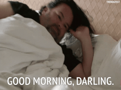 A Man Is Laying In Bed With The Words " Good Morning Darling " On The Bottom GIF