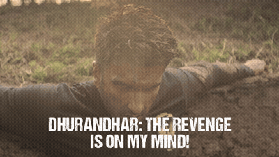 A Man Is Laying In The Dirt With The Words " Dhurandhar The Revenge Is On My Mind " Above Him GIF