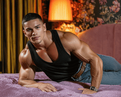 A Man Is Laying On A Bed Wearing A Watch GIF