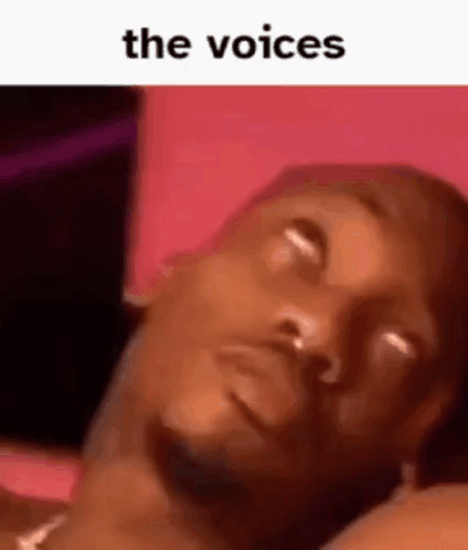 A Man Is Laying On A Bed With His Eyes Closed And The Words `` The Voices '' Written Above Him . GIF
