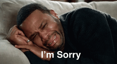 A Man Is Laying On A Couch With His Eyes Closed And The Words I 'M Sorry Written Below Him GIF