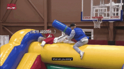 A Man Is Laying On A Large Inflatable Object And Asking What He Is Doing GIF