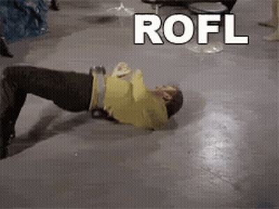 A Man Is Laying On The Floor With The Word Rofl Behind Him GIF
