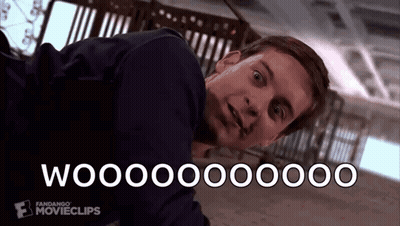 a man is laying on the floor with the words woooooo written on the bottom of his face .