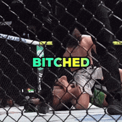 A Man Is Laying On The Ground In A Boxing Ring With The Word Bitches Above Him GIF