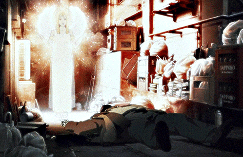 A Man Is Laying On The Ground In A Room With Boxes Of Sapporo Beer GIF