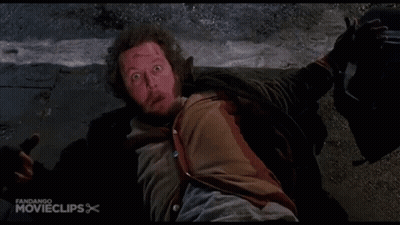A Man Is Laying On The Ground With His Mouth Open In A Movie Clip GIF