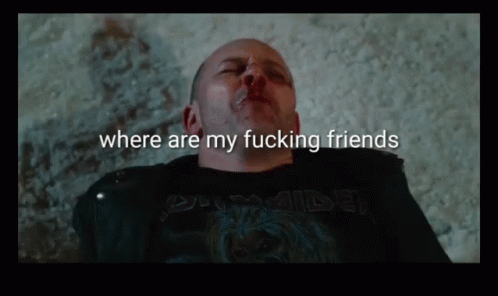 A Man Is Laying On The Ground With The Words Where Are My Fucking Friends Above Him GIF