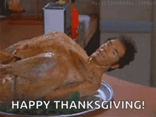 A Man Is Laying On Top Of A Turkey On A Plate With The Words Happy Thanksgiving . GIF