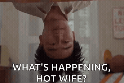 A Man Is Laying Upside Down On A Bed And Asking What 'S Happening , Hot Wife . GIF