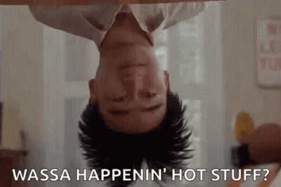 A Man Is Laying Upside Down On A Table With His Head Down And Says `` Wasa Happenin ' Hot Stuff '' . GIF