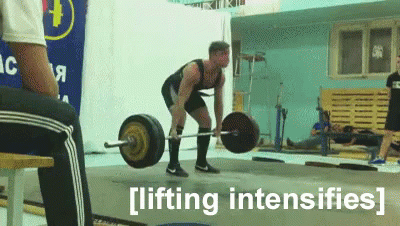 A Man Is Lifting A Barbell In A Gym With The Words Lifting Intensifies Behind Him GIF