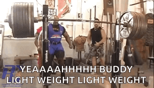 A Man Is Lifting A Barbell In A Gym With The Words Yeaaahhhh Buddy Light Weight Light Weight Behind Him GIF