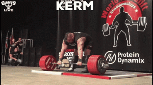 A Man Is Lifting A Barbell In Front Of A Sign That Says Kerm GIF