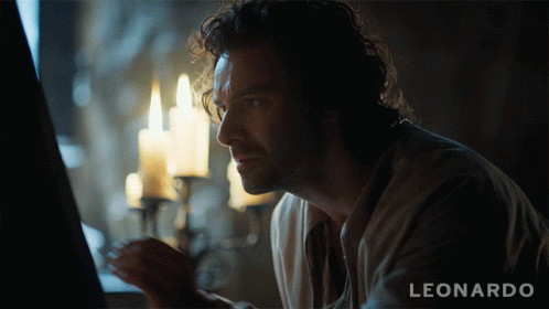 A Man Is Looking At A Computer Screen With The Name Leonardo On The Bottom GIF