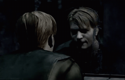 A Man Is Looking At His Reflection In A Dark Room GIF