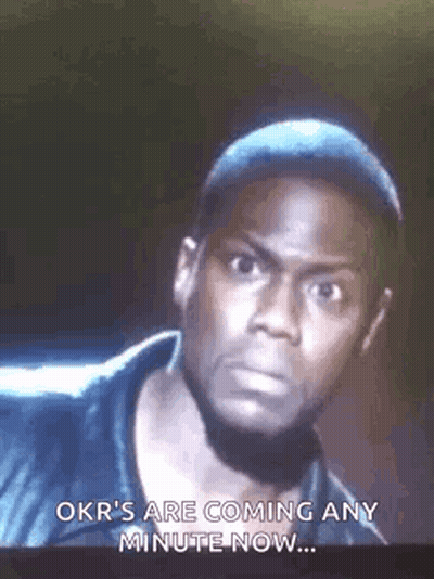 A Man Is Looking At The Camera And Says `` Okr 'S Are Coming Any Minute Now . '' GIF