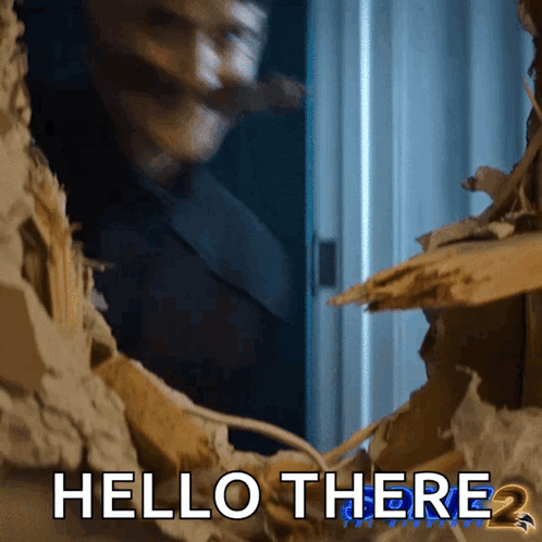 A Man Is Looking Through A Hole In A Wall With The Words Hello There 2 Below Him GIF