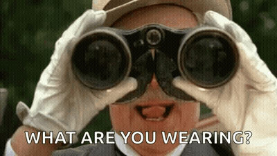 A Man Is Looking Through Binoculars With The Words `` What Are You Wearing ? '' Behind Him . GIF