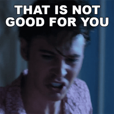 A Man Is Making A Face With The Words That Is Not Good For You Behind Him GIF