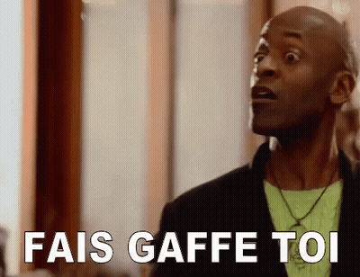 A Man Is Making A Funny Face And Saying `` Fais Gaffe Toi '' In French . GIF