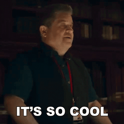 A Man Is Making A Funny Face And Saying `` It 'S So Cool '' With His Hands In The Air . GIF